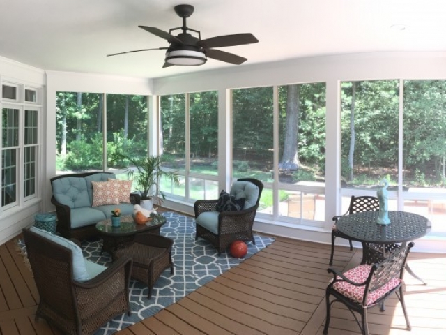 View of a sunroom addition overlooking the back patio