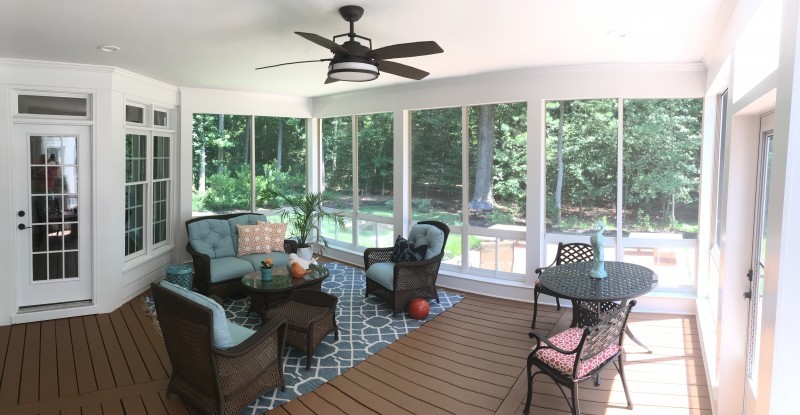 View of a sunroom addition overlooking the back patio
